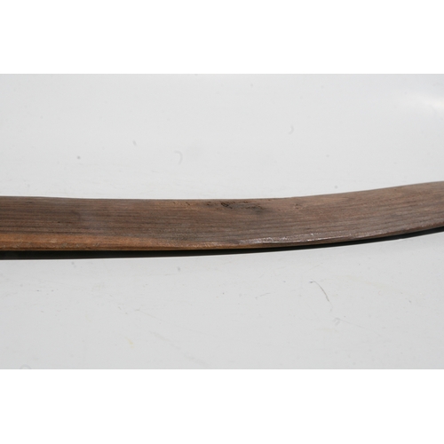 199 - An Australian Aboriginal boomerang with simple decoration, 77cms long.