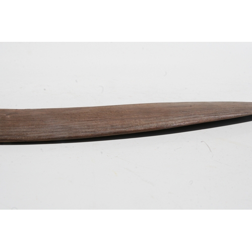 199 - An Australian Aboriginal boomerang with simple decoration, 77cms long.