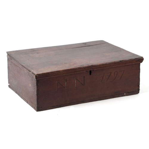 1002 - An 18th century oak bible box, the front panel carved 'NN 1798', 64cms wide.