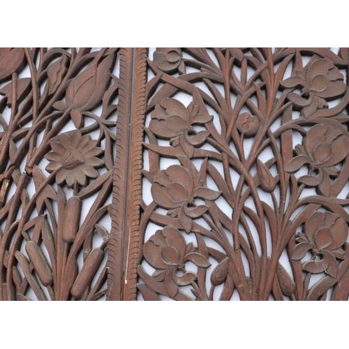 1011 - A set of four 19th century walnut carved and pierced panels depicting grape and vine, each 39 by 93c... 