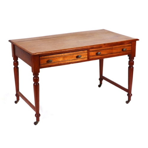 1016 - An Edwardian walnut writing table, the rectangular top above two frieze drawers, on turned tapering ... 