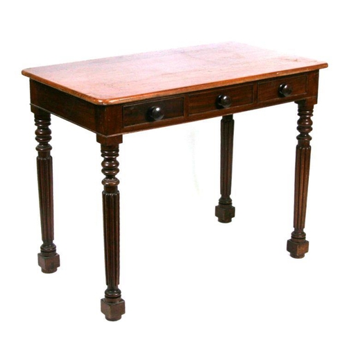 1021 - A Victorian mahogany side table with central faux frieze drawer flanked by two frieze drawers, on tu... 