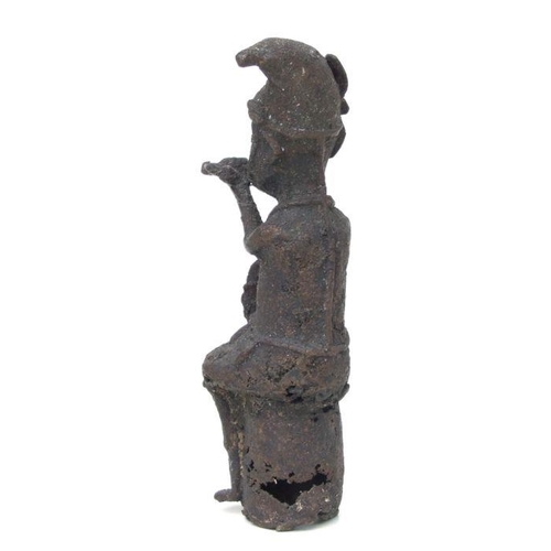 105 - A Benin bronze figural group, 22cms high; together with a similar figure of a seated musician, 25cms... 