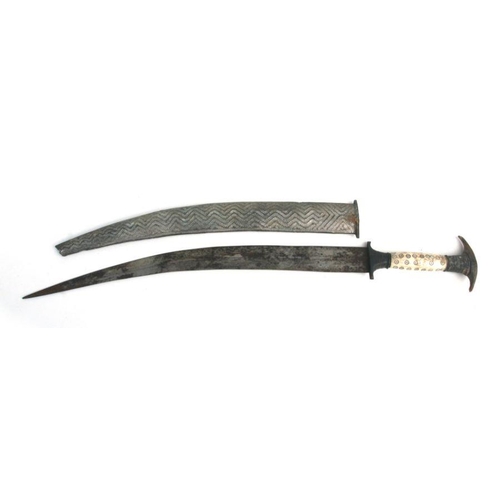 115 - An Arab dagger with horn and bone handle and curved steel blade and sheath, 52cms long.Condition Rep... 