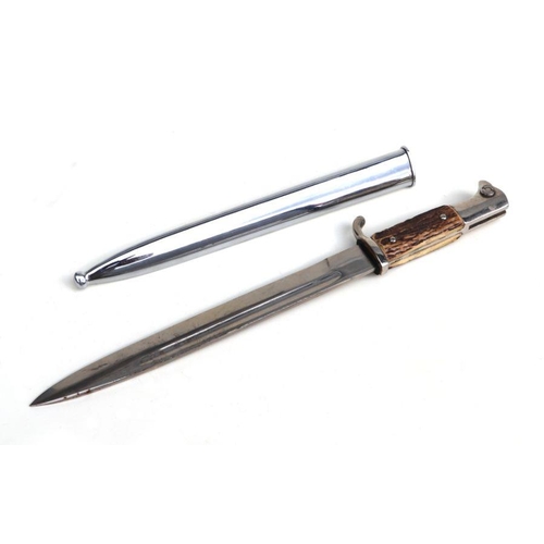 141 - A WWII German Solingen bayonet and scabbard, with antler handle and the blade impressed 'Solingen' a... 