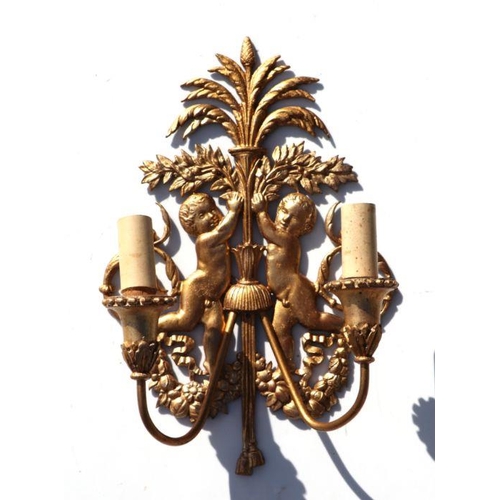 150 - A set of four gilt metal rococo style twin-branch wall lights, 37cms high (4).