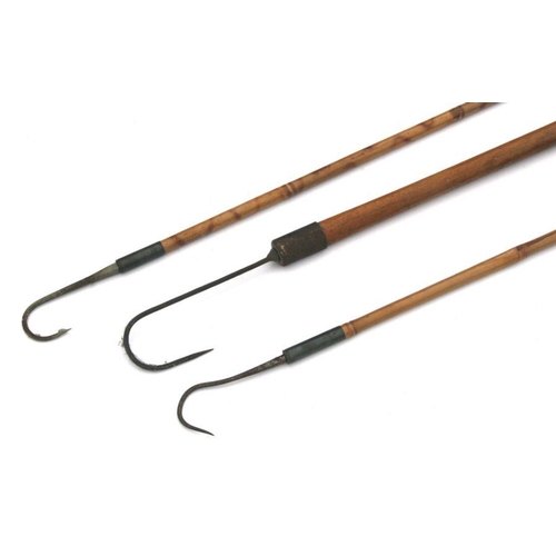 176 - Three early 20th century fishing gaffs, two with bamboo handles, the largest 133cms long (3).