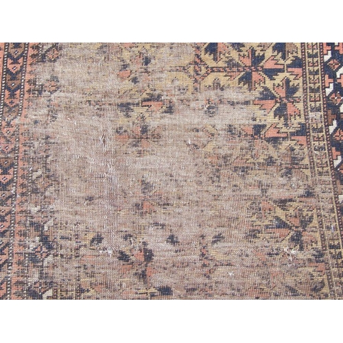 186 - A Persian Balouch hand knotted prayer rug with geometric design, on a beige ground, 154 by 86cms.