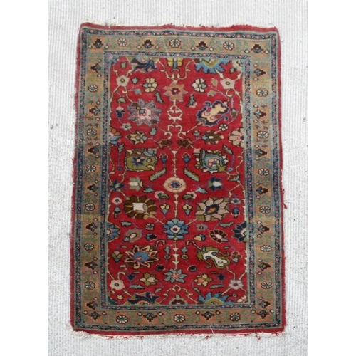 191 - A Caucasian rug with central medallions on a red ground within a multi border, 192 by 129cms; togeth... 