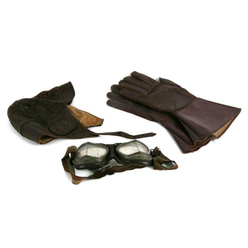 24 - An early 20th century kid leather full length driving coat; together with a pair of leather gauntlet... 