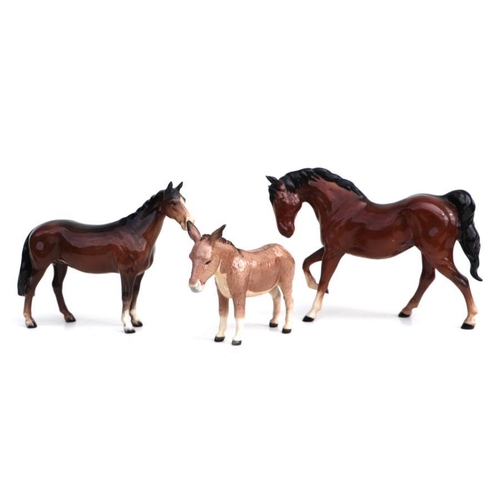 343 - A Beswick donkey; together with two Beswick horses (3).