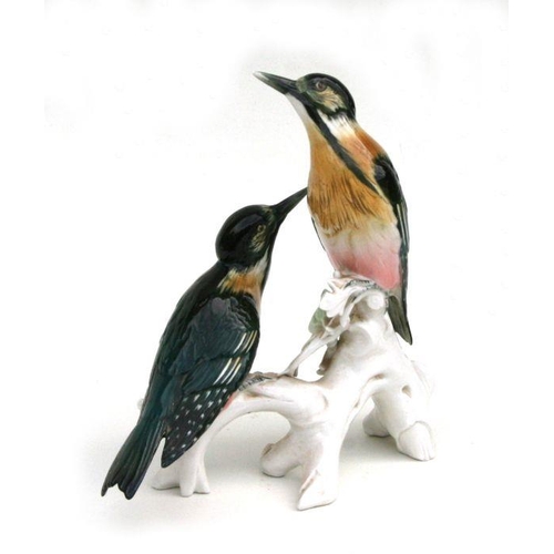 344 - A Karl Ens group depicting woodpeckers on a branch, 31cms high.