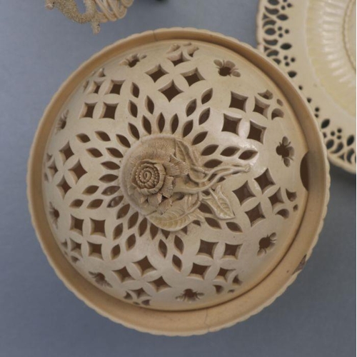 345 - A Belleek porcelain lattice work shallow dish, 25cms diameter; together with Leeds creamware style r... 