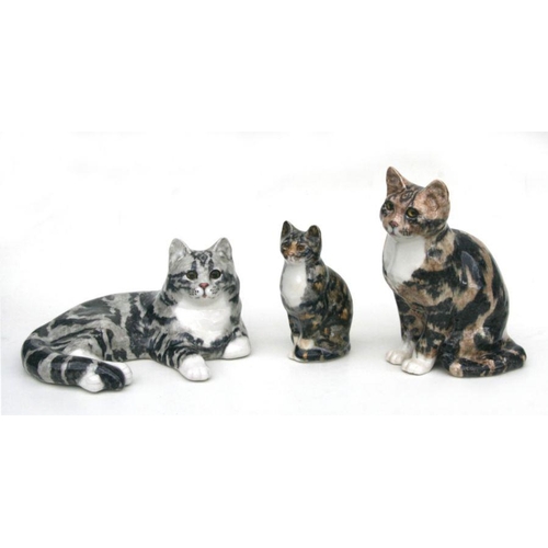 352 - A group of three Winstanley pottery cats, the largest 30cms high (3).