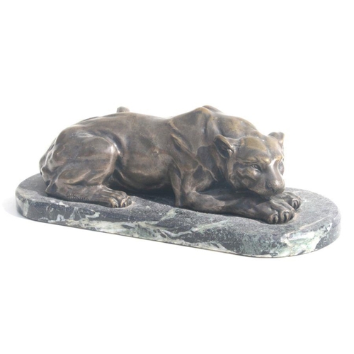 478 - Henri Payen (French 1894-1933) a silvered bronze figure of a recumbent lioness, mounted on a figured... 