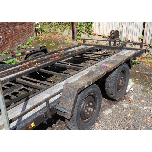 56 - A twin axle car transporter with manual winch and trailer board, approx 14ft in length.