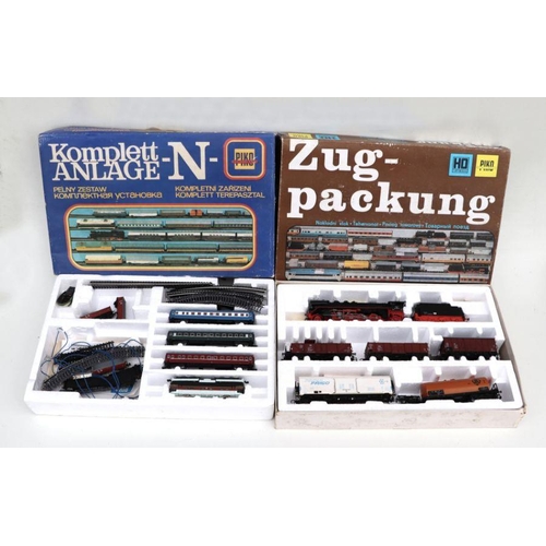 89 - A large quantity of Piko N gauge and HO gauge locomotives, carriages, buildings, track and accessori... 