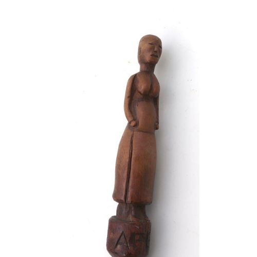 97 - A carved African tribal walking stick, the shaft carved with an intertwined snake, the handle carved... 