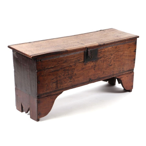 999 - An 18th century oak six-plank coffer with candle box, 102cms wide.