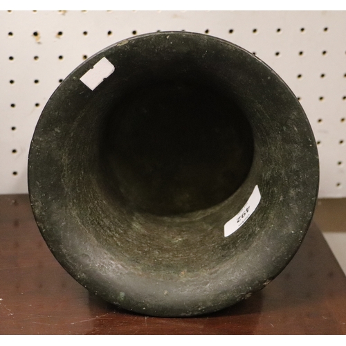 492 - A large cast bronze mortar and pestle, probably 18th century, 15cms high.