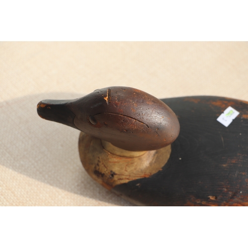 175 - A 19th century painted carved wooden decoy duck, 36cms long.