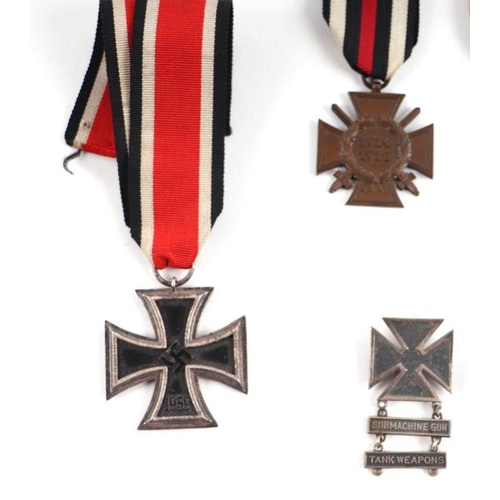 104 - A German WWII SS metal belt buckle, stamped 'RODO'; and Iron Cross Second Class; a General Assault b... 