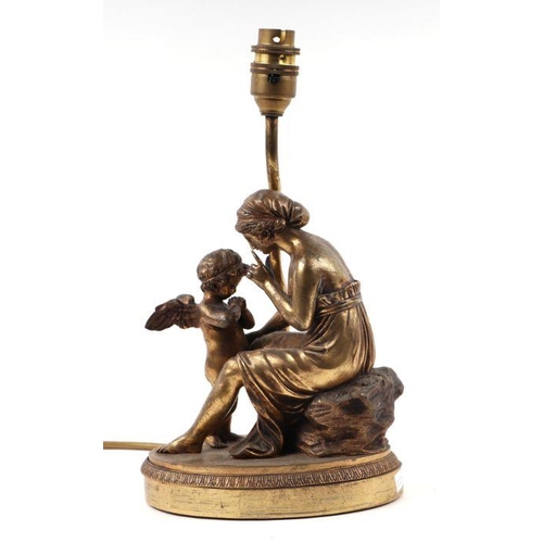 123 - A cast brass figural table lamp in the French taste, 22cms high.