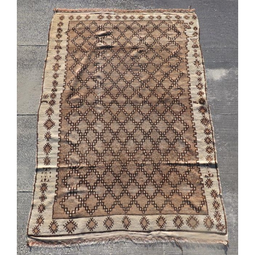 153C - A Moroccan Berber style Beni Ouarain Middle Atlas woollen hand knotted rug with repeat design on a b... 