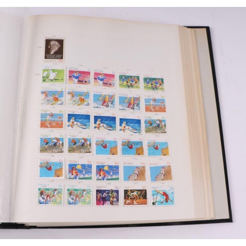 41 - Four albums containing assorted World stamps to include Singapore, South Africa, Jamaica, Australia ... 