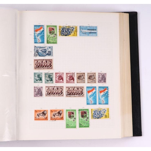 41 - Four albums containing assorted World stamps to include Singapore, South Africa, Jamaica, Australia ... 