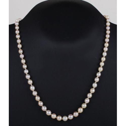 502 - A Victorian pearl necklace with yellow coloured metal and gem set clasp.