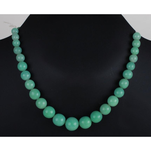 511 - A graduated green hardstone bead necklace.