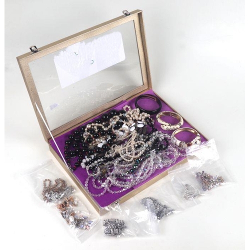 520 - A quantity of assorted costume jewellery to include bead necklaces, earrings and similar items.