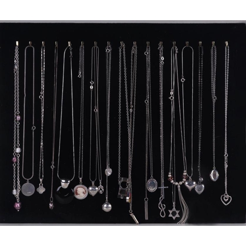 522 - A quantity of silver fashion necklaces and pendants.