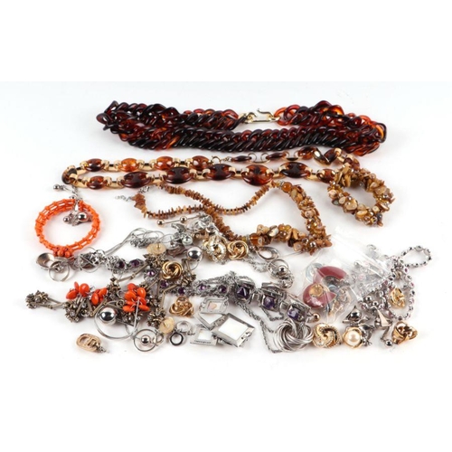 523 - A quantity of vintage costume jewellery to include necklaces, bracelets, earring and a novelty faux ... 