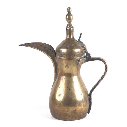 534 - A Turkish / Islamic brass dallah coffee pot, 30cms high.