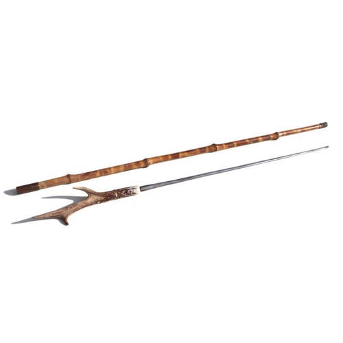 70 - A bamboo shafted sword stick with a 48cms (19ins) square section blade and a stag horn handle. Overa... 