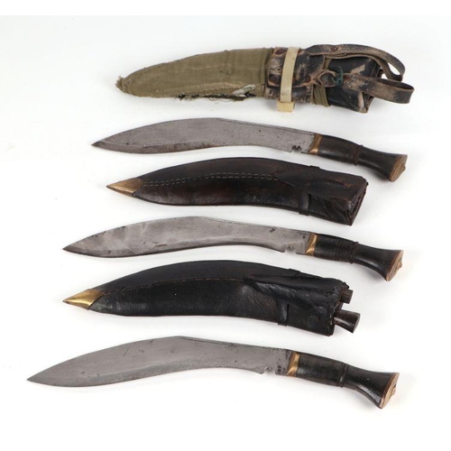 78 - A Nepalese Kukri with Chakmak and Karda miniature knives in a leather scabbard, 40cms long; together... 