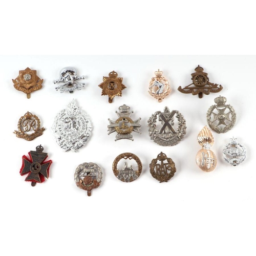 90 - A collection of military cap badges to include Royal Engineers, RAF, the Cameroons, Northamptonshire... 