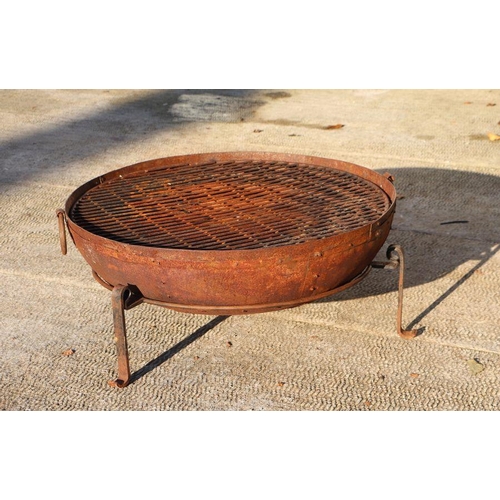 1 - A large iron fire pit on tripod stand, 90cms diameter.