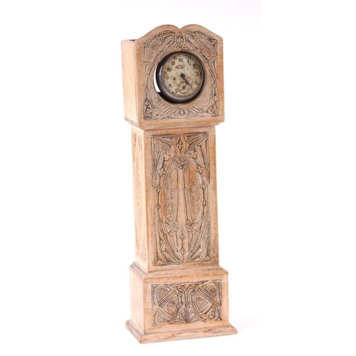 1039 - An Art Nouveau pocket watch stand in the form of a miniature longcase clock, 31cms high.