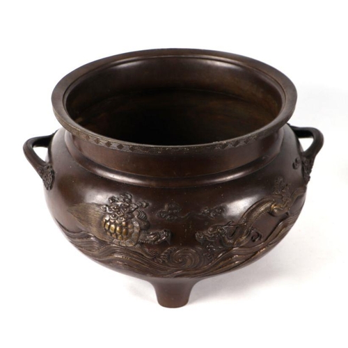 1364 - A large Japanese bronze two-handled tripod censer or jardiniere decorated in relief with phoenix and... 