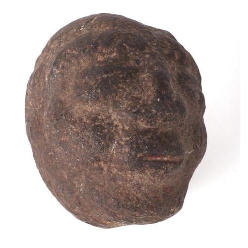 1496 - An early carved stone head, 14cms high.