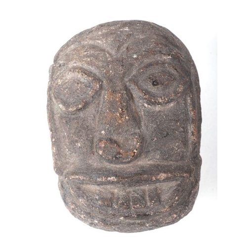 1497 - An early carved stone head, 13cms high.