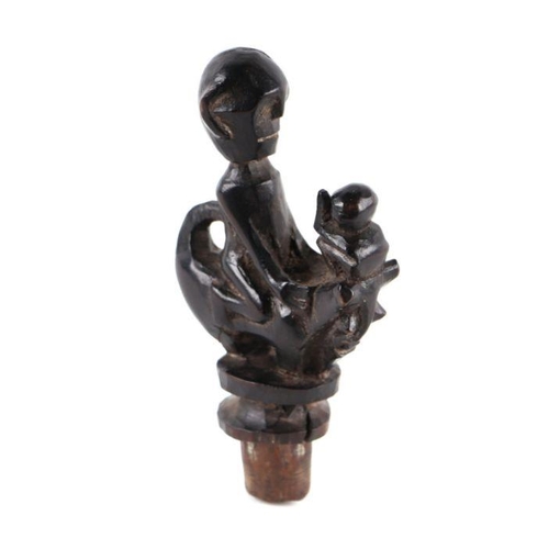 1499 - A Batak type carved wood medicine bottle stopper, approx 11cms high.