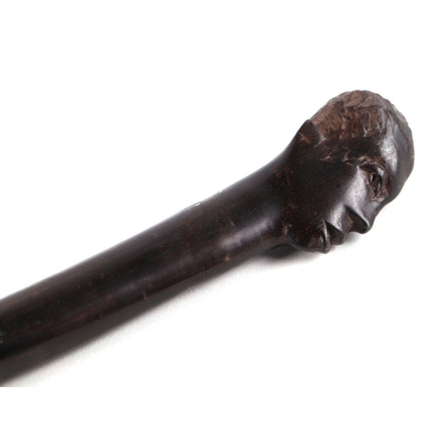 1500 - An African tribal hardwood walking cane, the handle carved in the form of a mans head in profile, 92... 