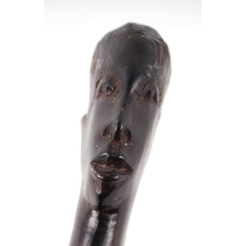 1500 - An African tribal hardwood walking cane, the handle carved in the form of a mans head in profile, 92... 