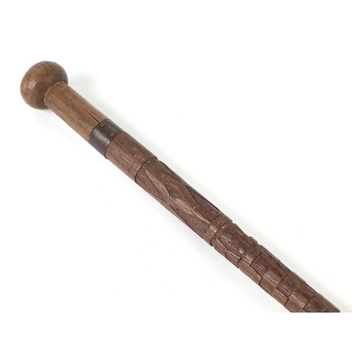 1500 - An African tribal hardwood walking cane, the handle carved in the form of a mans head in profile, 92... 