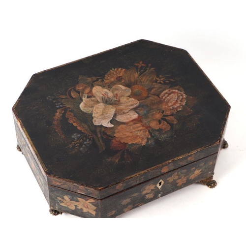 200 - A 19th century painted work box of elongated octagonal form decorated with flowers, on pressed brass... 