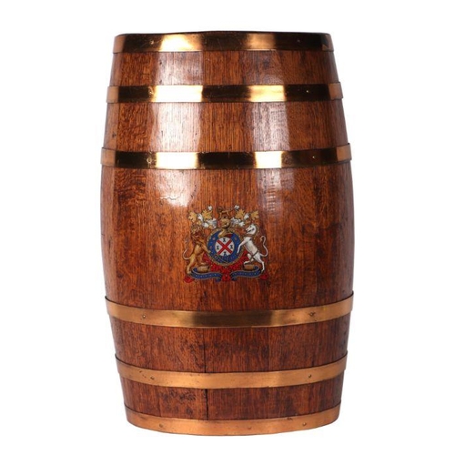 2189 - An oval coopered oak barrel stick stand with armorial decoration, 60cms high; together with a select... 